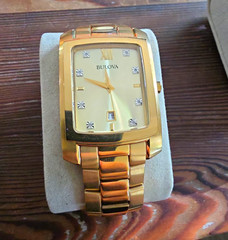Bulova Men&rsquo;s Gold-Tone Rectangle Quartz Date Champagne Dial Roman Bracelet