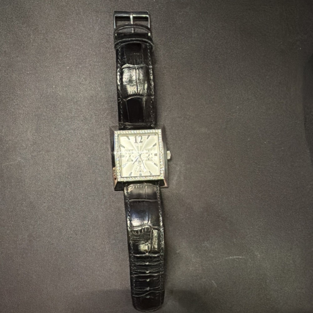 GUESS Timeless Beauty Women&rsquo;s Quartz Square Silver Dial Black Leather Strap